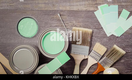 Home inprovement project. Painting wood with turquose color paint. Stock Photo