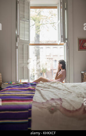 Young woman talking on her Smartphone Stock Photo