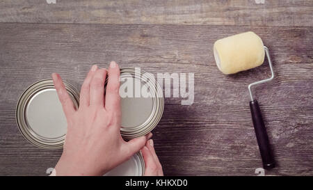 Home inprovement project. Painting wood with turquose color paint. Stock Photo