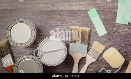 Home inprovement project. Painting wood with turquose color paint. Stock Photo