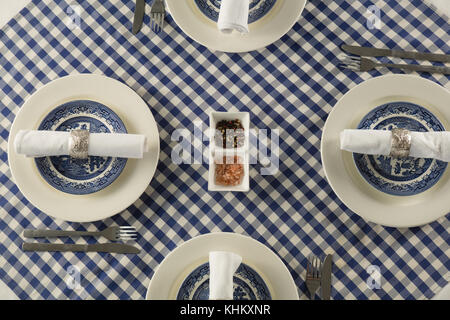 Overhead of rolled up napkin arranged on plate Stock Photo