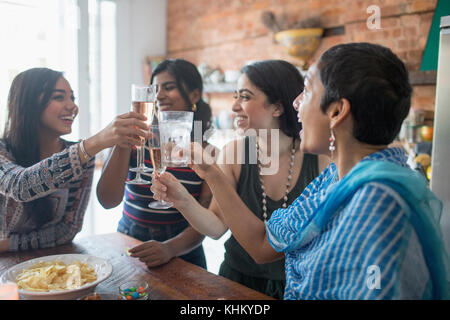 Young women making a toast at a party Stock Photo