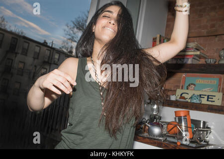 Young woman dancing at a party Stock Photo