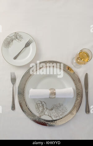 Overhead view of plate and cutlery set elegantly on a table Stock Photo