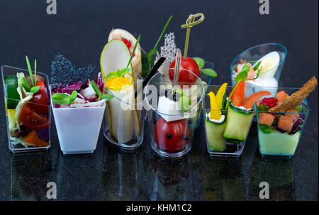 Mini canap with elements of molecular kitchen on white background Stock Photo