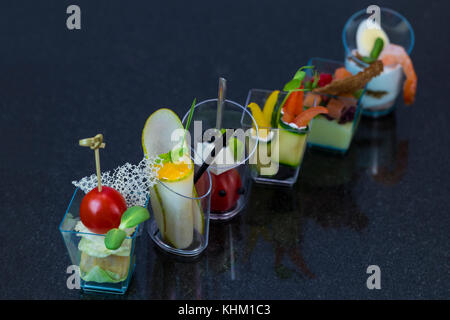 Mini canap with elements of molecular kitchen on white background Stock Photo