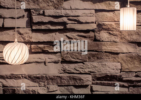 Lamp with stone wall as background Stock Photo