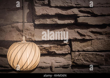 Lamp with stone wall as background Stock Photo