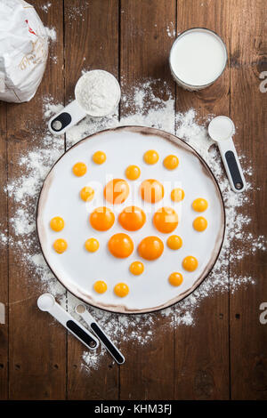 Bakery ingredients - flour, eggs, butter, sugar, yolk. Sweet pastry baking concept. Flat lay, top view. Stock Photo