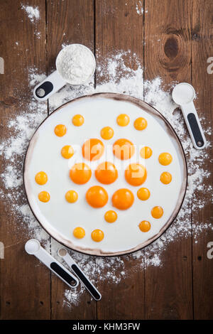 Bakery ingredients - flour, eggs, butter, sugar, yolk. Sweet pastry baking concept. Flat lay, top view. Stock Photo