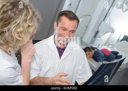 Doctor laughing at xray Stock Photo