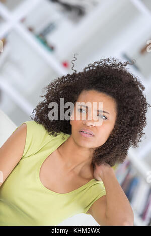 young beautiful woman in painful expression suffering Stock Photo