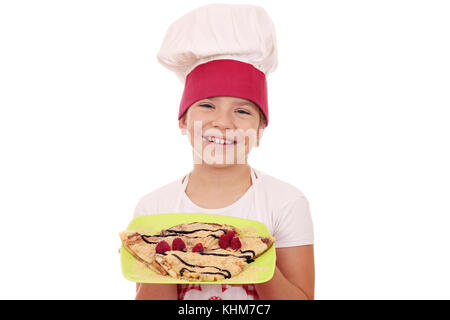 happy little girl cook with sweet crepes Stock Photo