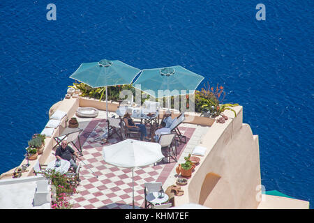 Romantic terrace on the cliff, luxury hotel at the crater edge of the village Oia, Santorin island, Cyclades, Aegean,Greece Stock Photo
