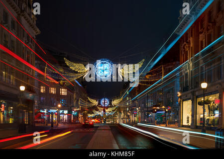 LONDON - NOVEMBER 18, 2017: Christmas lights on Regent Street, London, UK. The Christmas lights attract thousands of shoppers during the festive seaso Stock Photo