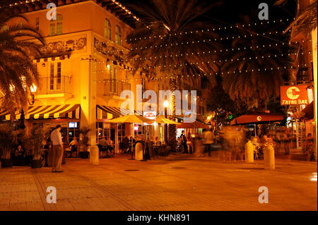 Bustling crowds of people in the restaurant and shopping street of Espanola Way, historic Spanish village of South Beach, Miami, Florida, USA. Stock Photo