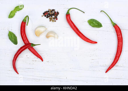 Red hot chili peppers chilli cooking ingredients background top view above Stock Photo