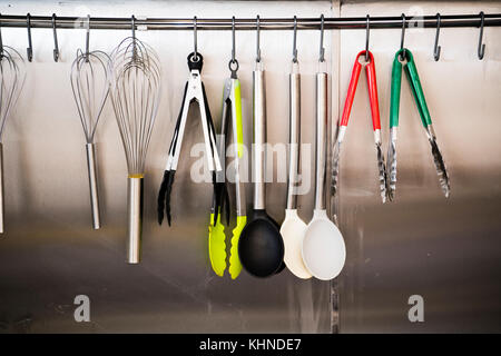 A rack of new kitchen implements in the kitchen of the Cletwr Cafe and community shop. Tre'r Ddol, Ceredigion Wales UK