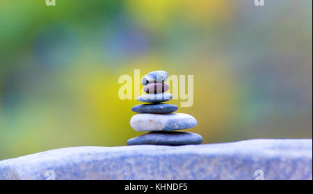 Balanced several stones on blurred beautiful background Stock Photo