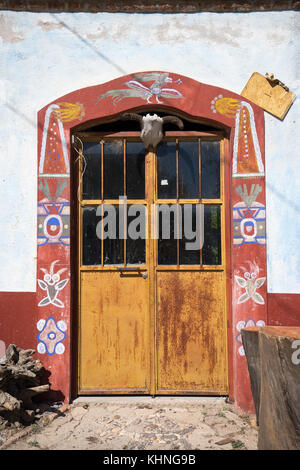 mexican door with painted frame in mineral de pozos mexico Stock Photo