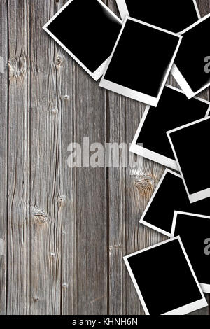 photos laid on wooden table background. Stock Photo