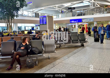 Relaxing while waiting in airport departure lounge at Bristol Airport, UK Stock Photo