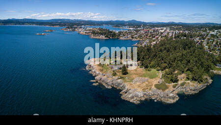 Aerial panoramic landscape view of a beautiful rocky shore on Pacific Coast. Taken in Saxe Point Park, Victoria, Vancouver Island, British Columbia, C Stock Photo