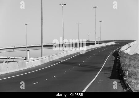 Road highway overhead flyover ramp entry exit structures in black and white. Stock Photo