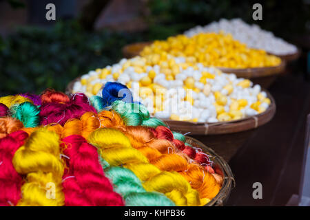 Colorful Thai Silk Threads And Cocoons In Baskets Stock Photo