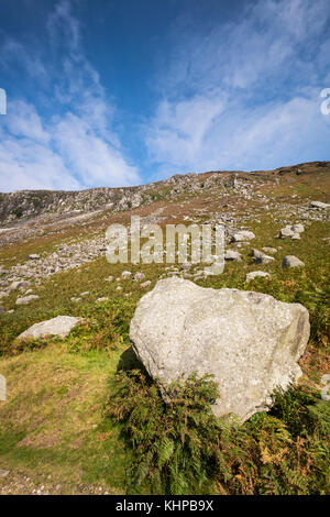 Large schist boulder by the miners village in Glendalough, Wicklow ...