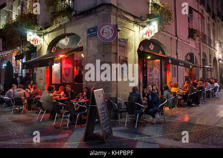 Bars and restaurants night atmosphere in old city town of Nantes, Loire Atlantique, France. Rue de la Juiverie and Rue des Chapeliers Stock Photo