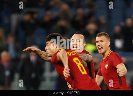 Rome, Italy. 18th Nov, 2017. Roma s Diego Perotti, left, celebrates with his teammates Radja Nainggolan, center, and Edin Dzeko, after scoring on a penalty kick during the Serie A soccer match between Roma and Lazio at the Olympic stadium. Credit: Riccardo De Luca/Pacific Press/Alamy Live News Stock Photo