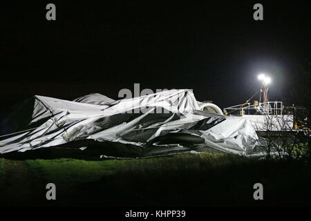 The remains of the Airlander 10, the world's largest aircraft, lies on the ground at Cardington airfield in Bedfordshire, as the aircraft, came loose from its moorings causing its hull to rip and deflate. Stock Photo