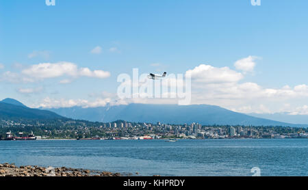 Seaplane taking off over Vancouver bay - BC, Canada Stock Photo