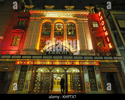 Front view of the entrance to the Phoenix Theatre in London colourfully illuminated  at night Stock Photo