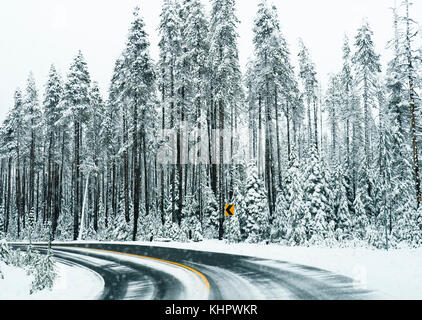 Southern Oregon snow zone curve in road near Crater Lake. Stock Photo