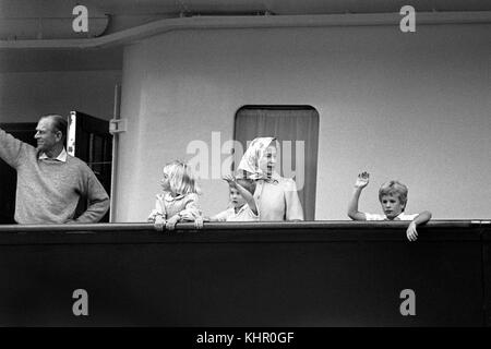 07/08/1985. The Duke of Edinburgh and Queen Elizabeth II with three of their grandchildren (left to right) Zara Phillips, Prince William and Peter Phillips, on board Britannia at Southampton docks. The Royal couple will celebrate their platinum wedding anniversary on November 20. Stock Photo