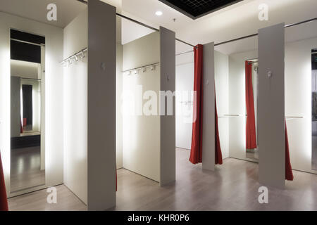 Fashion boutique interior, fitting room. The client changes clothes in