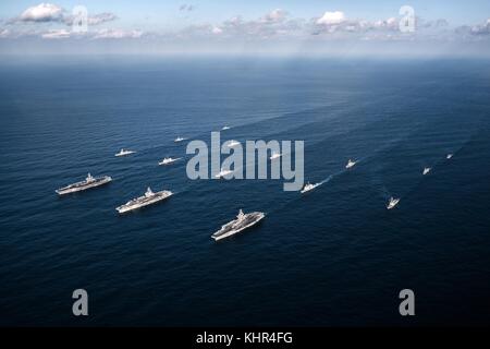 U.S. and South Korean Navy ships steam in formation November 12, 2017 in the Pacific Ocean.  (photo by Aaron B. Hicks via Planetpix) Stock Photo