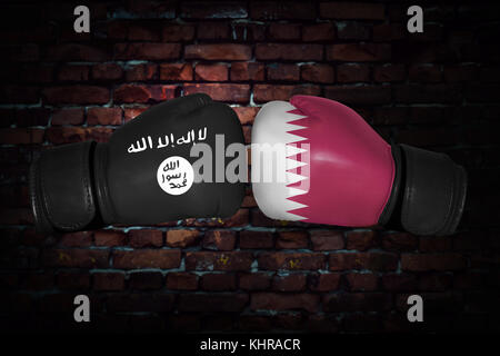 A boxing match. Confrontation between the Qatar and ISIS. Islamic state and Qatari national flags on Boxing gloves. Sports competition between the two Stock Photo