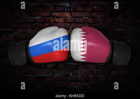 A boxing match. Confrontation between the Qatar and Russia. Russian and Qatari national flags on Boxing gloves. Sports competition between the two cou Stock Photo