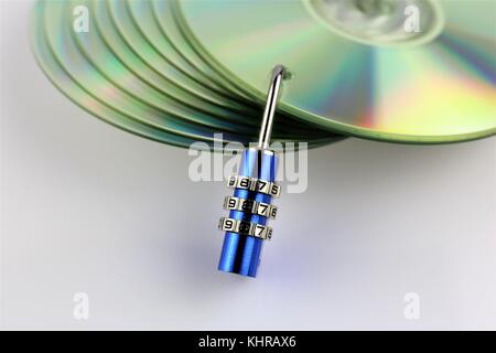 An concept Image of a cd and a lock - data security Stock Photo