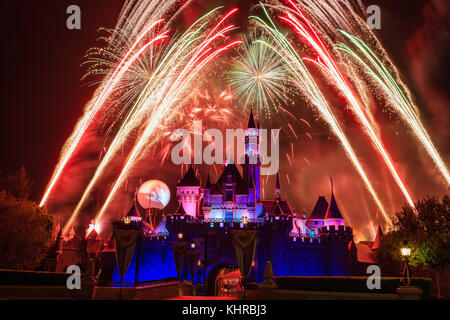 Anaheim: Night view with fireworks of the famous Cinderella castle of Disneyland on OCT 1, 2014 at Anaheim, Orange County, California, United States Stock Photo