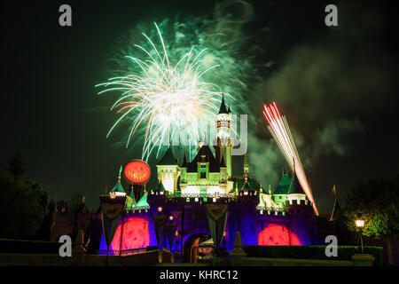 Anaheim: Night view with fireworks of the famous Cinderella castle of Disneyland on OCT 1, 2014 at Anaheim, Orange County, California, United States Stock Photo