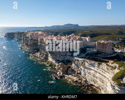 Aerial view of Bonifacio old town built on cliffs of white limestone, cliffs. Harbor. Corsica, France. Strait of Bonifacio Stock Photo