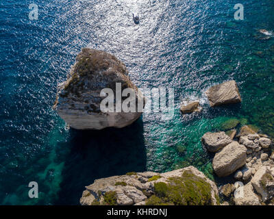 Aerial view on white limestone cliffs, cliffs. Bonifacio. Boats sailing with tourists. Corsica, France. Strait of Bonifacio Stock Photo