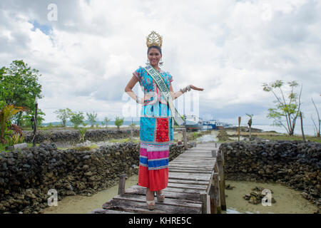 Michelle Victoria Alriani, 20, Miss Earth Indonesia 2017 pose for camera as a special guest during Wakatobi Wave Festival in Wanci, Wangi-Wangi. Stock Photo