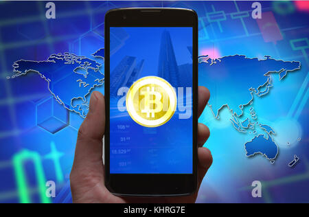 Bitcoin concept wallpaper. Bitcoin symbol at smartphone screen. Mobile wallet, bitcoin exchange concept. Stock Photo