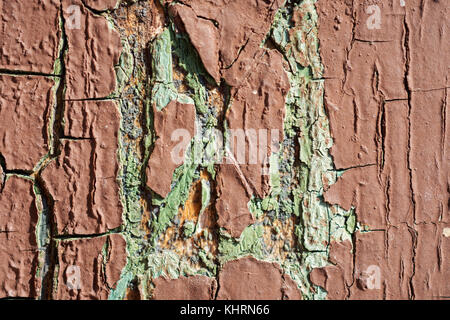 Texture Of Brown And Cyan Cracked Paint On Wooden Wall