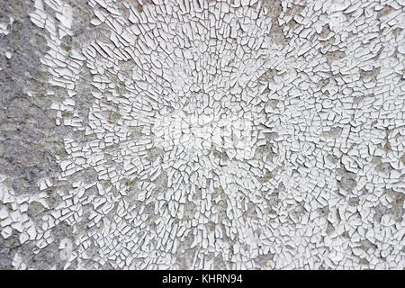 Texture Of Cracked And Crumbling White Paint In Circular Pattern On Cement Wall Stock Photo